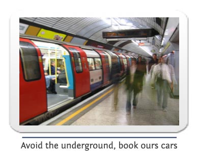 london underground train stopped at a tube station